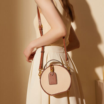 Genuine leather women's bag, versatile for spring and summer 2024. Top layer of cowhide with contrasting lychee patterns for women's handheld single shoulder round cake bags
